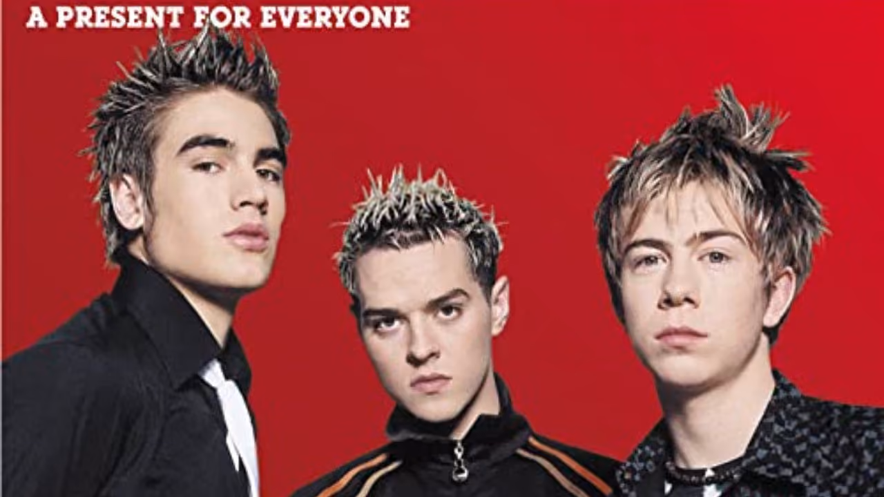The cover of Busted's album A Present for Everyone, the three of them against a red background