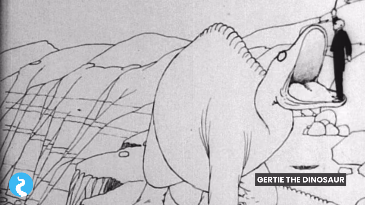 A still from Gertie the Dinosaur: the line-drawn sauropod rearing back with its mouth wide open, a tiny man in a black suit standing on its lower jaw