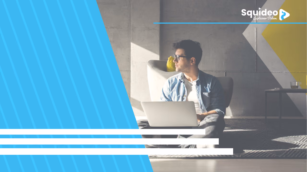 A Squideo banner: a man in glasses sitting on the floor with a laptop in a sunlit concrete room, behind a blue diagonal panel