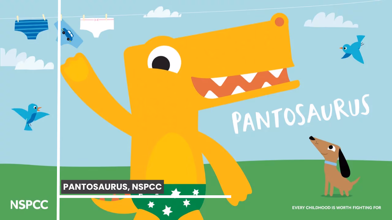 The NSPCC's Pantosaurus: a yellow dinosaur in green star-print pants dancing on a lawn under a washing line of underwear, a dog watching, with the NSPCC logo and 'every childhood is worth fighting for'
