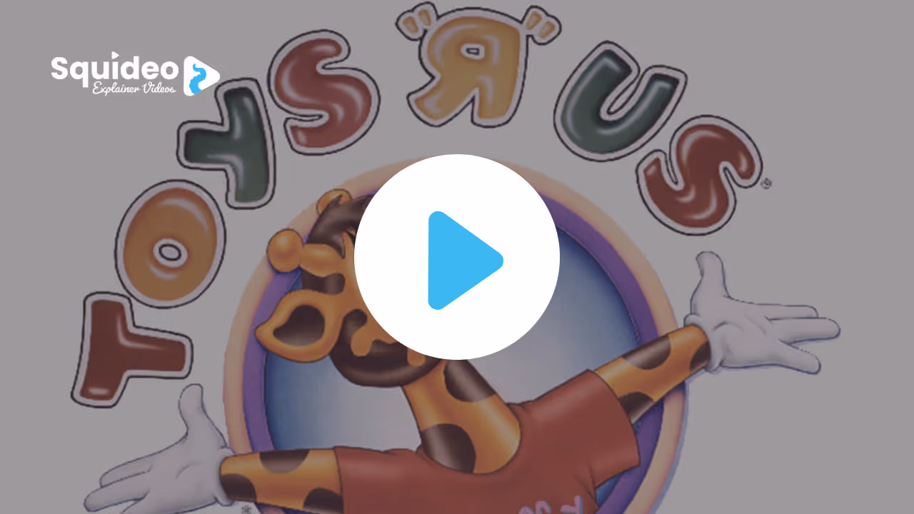 Geoffrey the giraffe in a red t-shirt, arms flung wide, inside the Toys 'R' Us logo
